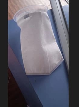 Bag filter with multiple layers of filtration media